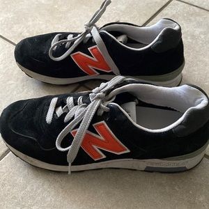 Retro style New Balance running shoes. Back in style now. Dark blue with orange.
